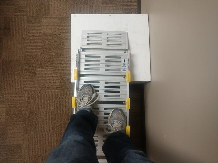 12" Roll-A-Ramp track ramps from Reliable Ramps being traversed by a man