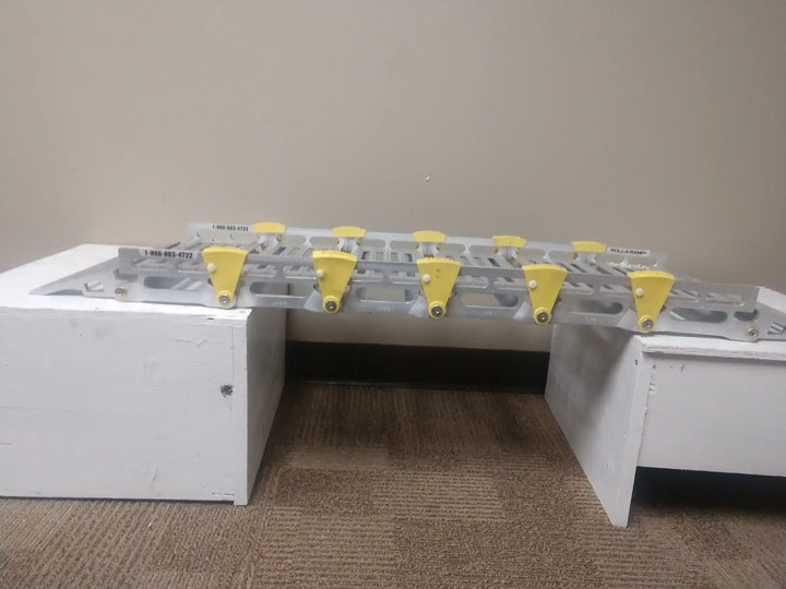 12" Roll-A-Ramp track ramps from Reliable Ramps side view of the bridging of two platforms