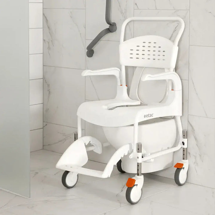 White commode chair with wheels in a bathroom setting