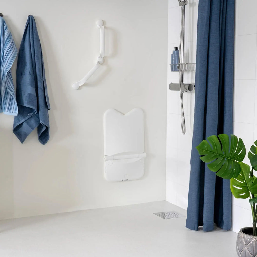 ETAC relax shower seat folded up against the wall white