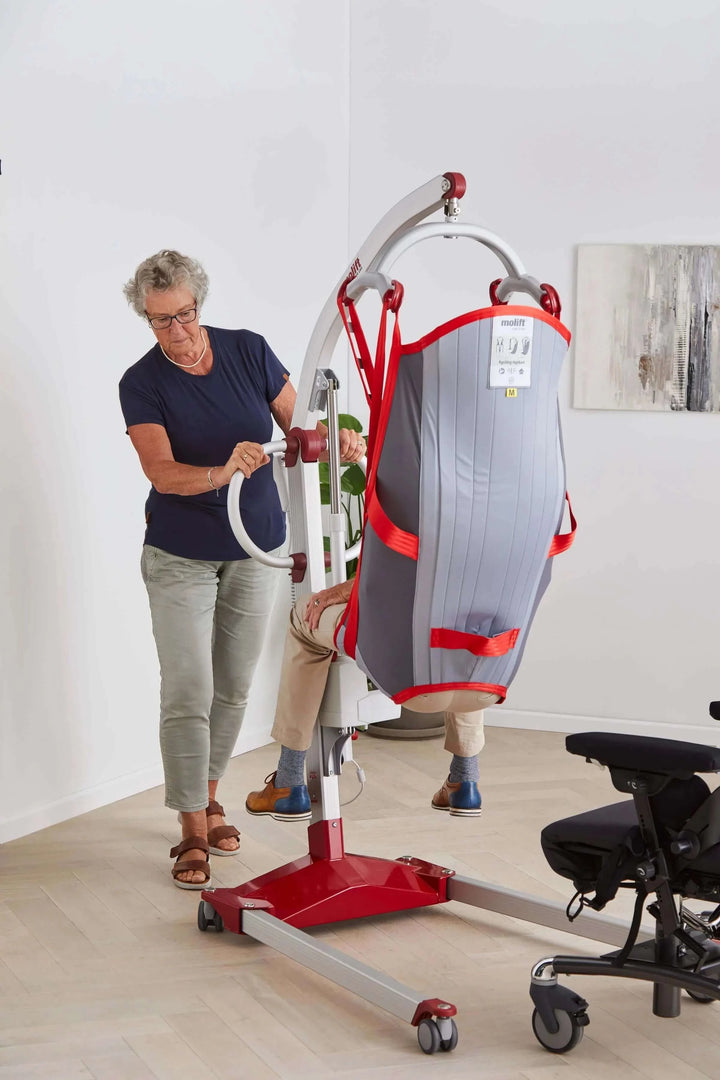 Molift - RgoSling Highback Padded Patient Sling being used by a patient and their nurse