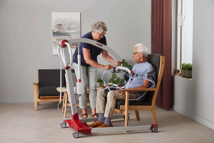 Molift - RgoSling MediumBack Padded Patient Sling being used by a patient and their nurse
