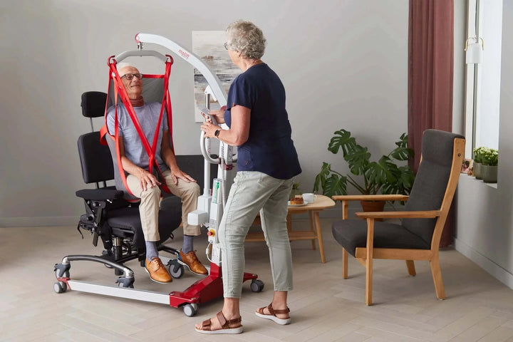Molift - RgoSling Highback Net Patient Sling being used by a patient and their nurse