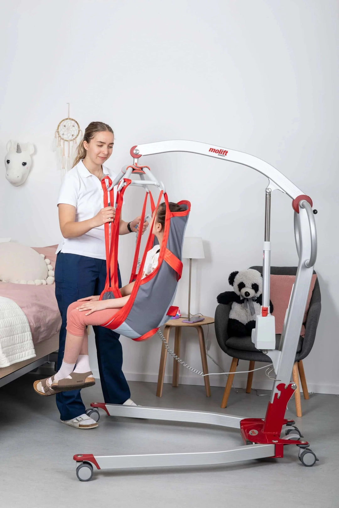 Molift - RgoSling Highback Padded Patient Sling being used by a patient and their nurse