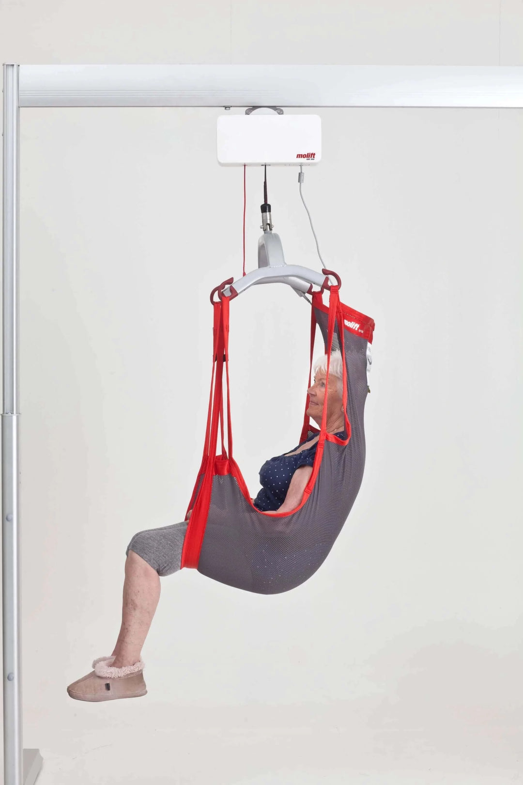 Molift - RgoSling Comfort HighBack Patient Sling being used by a patient in a lift