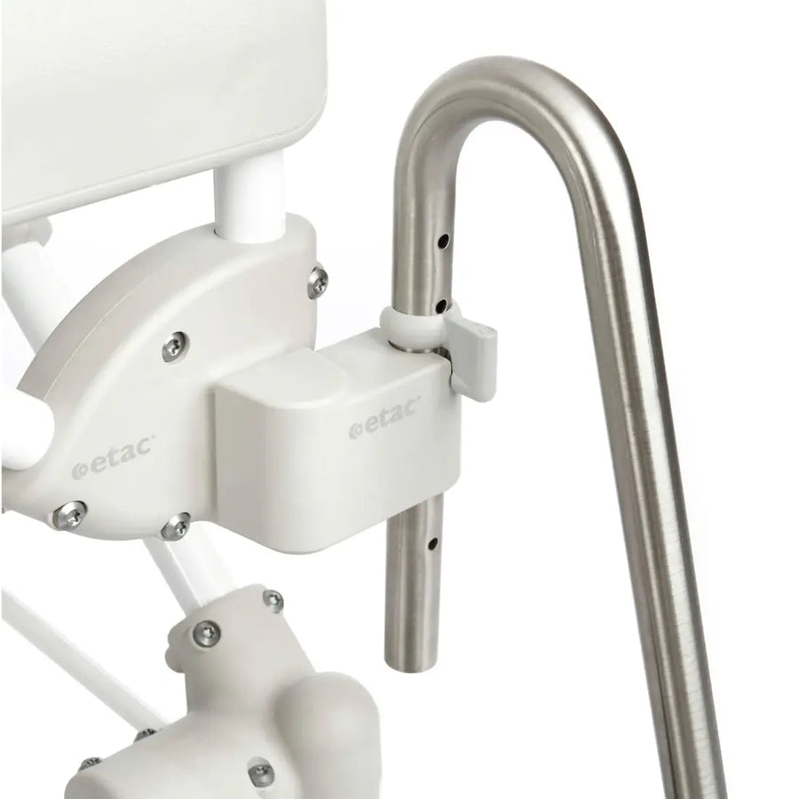White stairlift with metal handrail on a white background