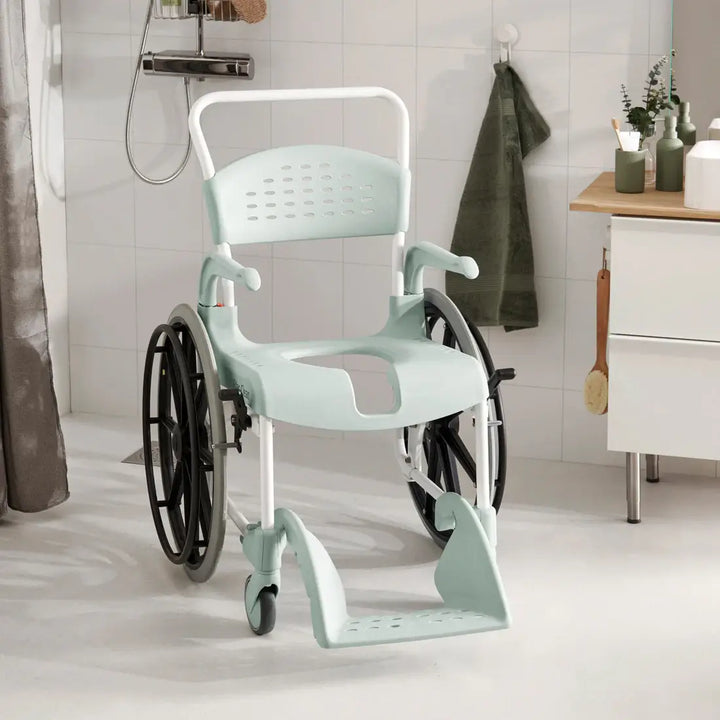 Mint green shower chair with wheels in a bathroom setting