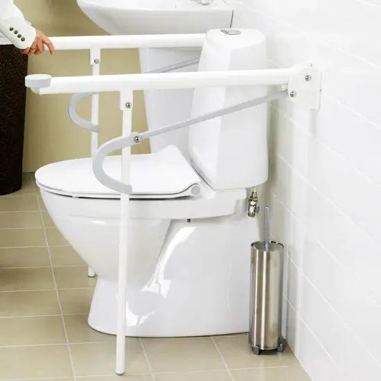 White toilet with a support frame in a bathroom setting