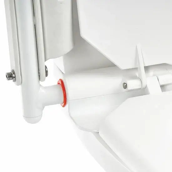 Close-up of a white radiator with a red accent on a white background