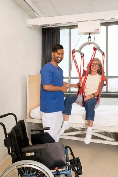 Molift Air 200 Ceiling Lift Motor Reliable Ramps being used by patient