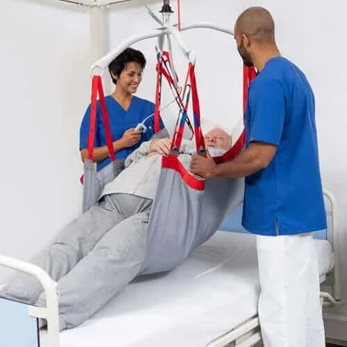 Molift - RgoSling Repositioning Sheet Patient Lifts Accessories Molift with 2 nurses helping a patient in bed