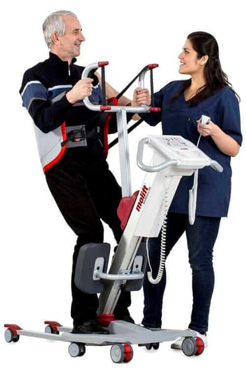 Molift - Quick Raiser 205 Sit-To-Stand Patient Lift - patient being helped out of wheelchair by nurse