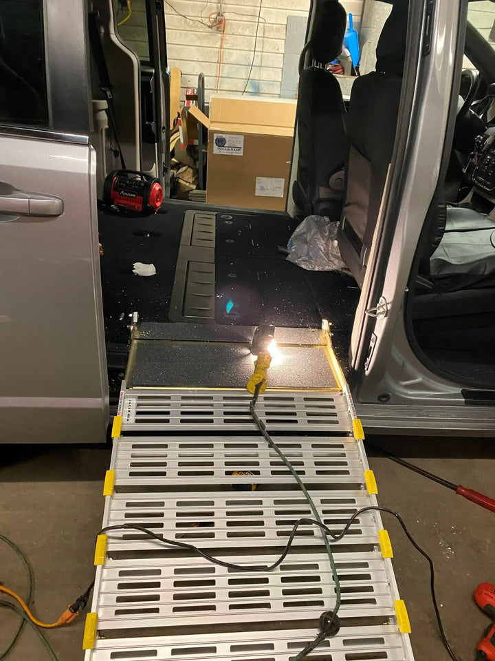 Roll-A-Ramp manual van ramp from Reliable Ramps being shown during the install