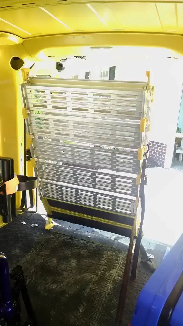 Roll-A-Ramp manual van ramp from Reliable Ramps with an inside look of it folded up