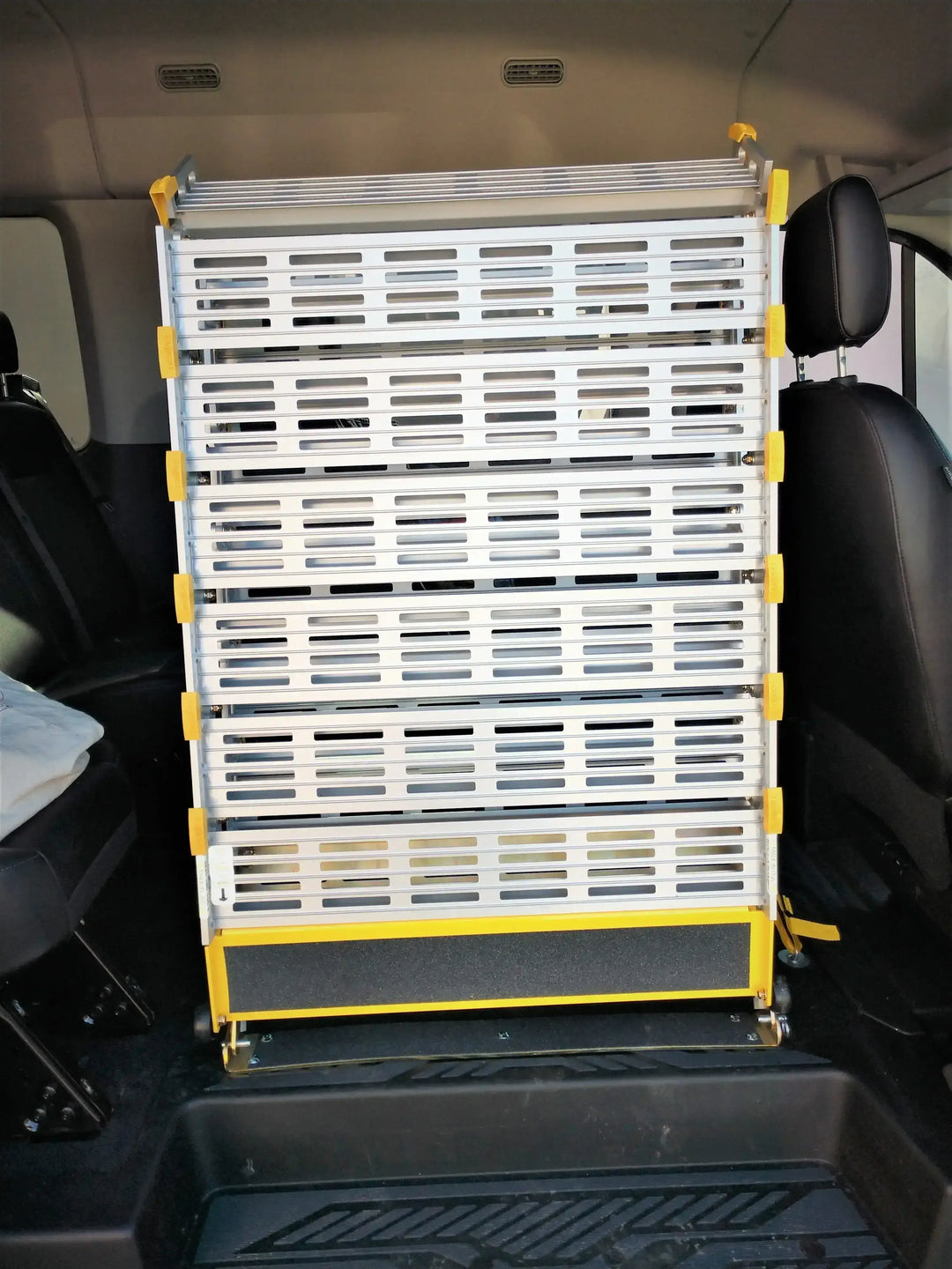 Roll-A-Ramp manual van ramp from Reliable Ramps zoomed in view of it installed in a van