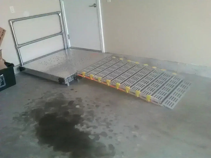 roll-a-ramp portable aluminum wheelchair ramp at reliable ramps short ramp with no handrails in a garage and a platform