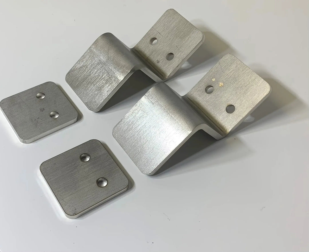 Roll-A-Ramp Seg Mount Brackets From Reliable Ramps zoomed in on a white surface