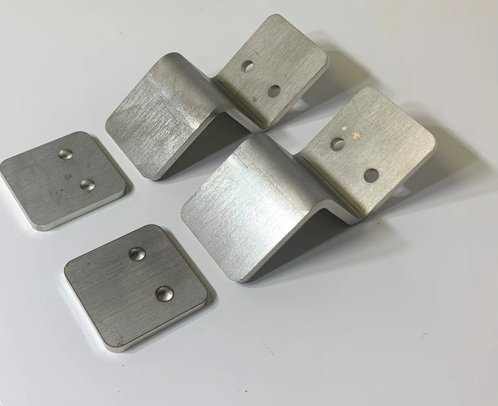 Roll-A-Ramp Seg Mount Brackets From Reliable Ramps zoomed in on a white surface