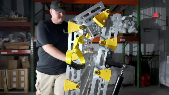 roll-a-ramps assisted bi fold van ramp on reliable ramps folded up in warehouse