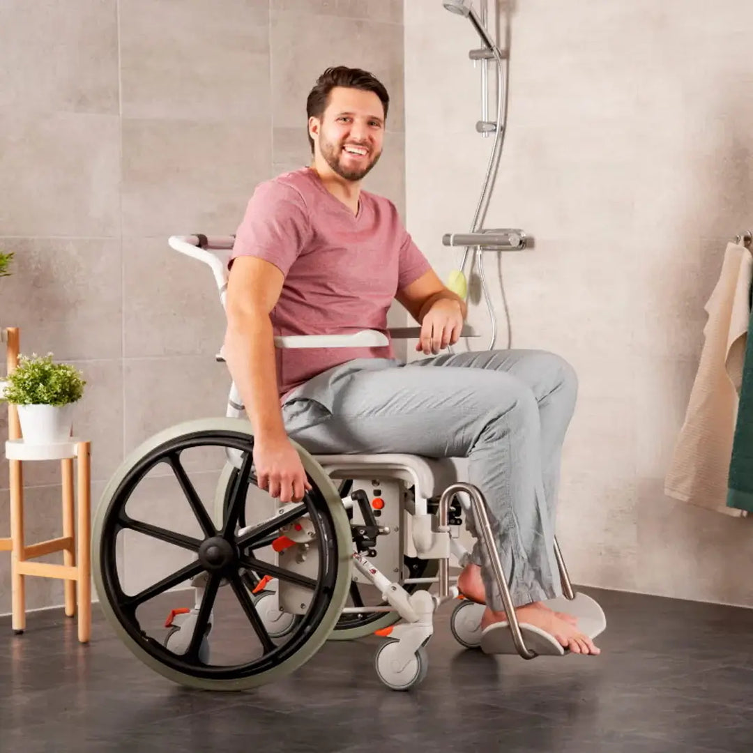Man using a wheelchair in a bathroom setting