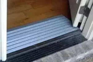 American Access - Hero Aluminum Threshold Ramp for Wheelchairs - ramp being used at a doorway