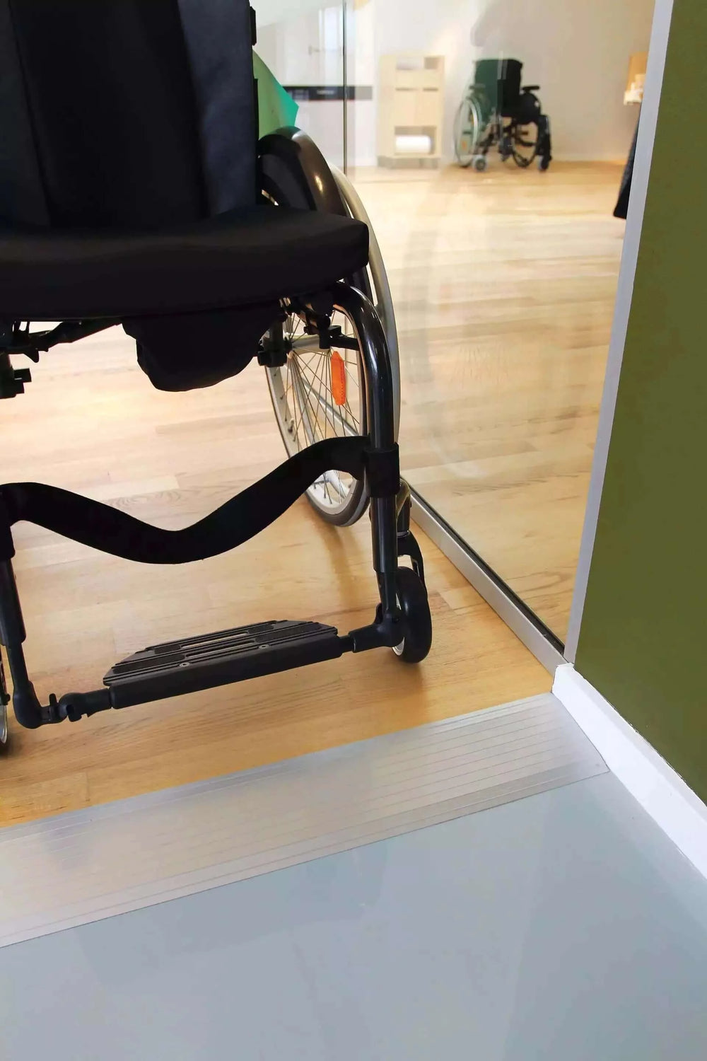 Guldmann - Stepless Aluminum Doorstep Cover Plate being used in a home