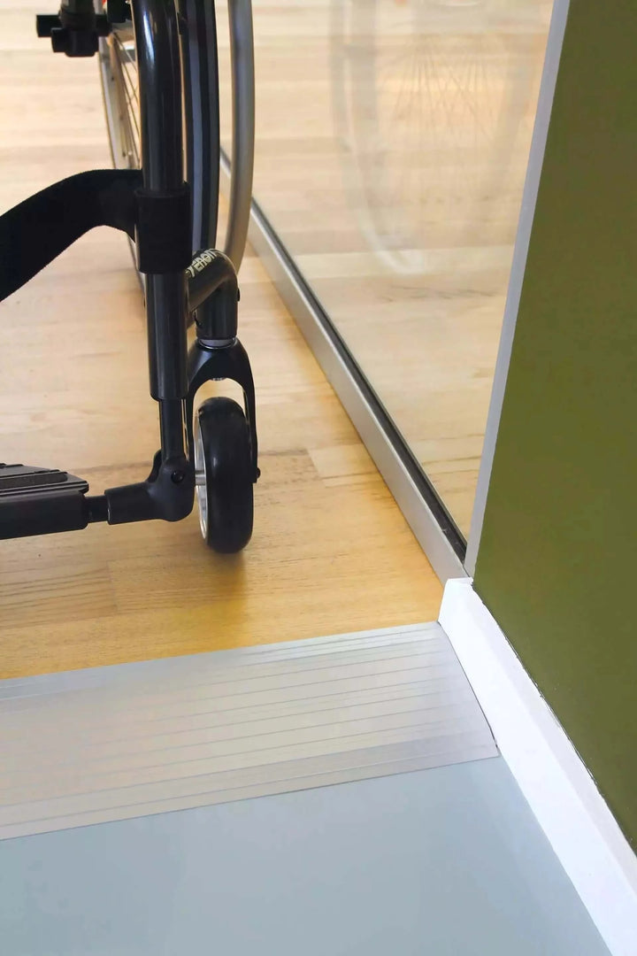 Guldmann - Stepless Aluminum Doorstep Cover Plate being used over a small home's threshold