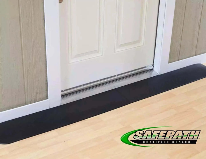 SafePath - EZ Edge Transition Rubber Threshold Ramp - 82" Width being used in front of a white door