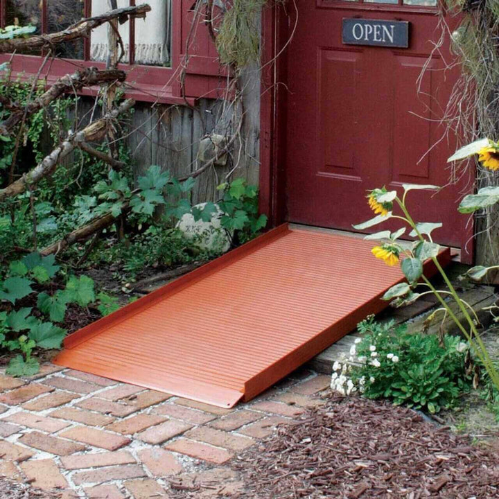 AlumiRamp - AlumiLite Solid Aluminum Curb Wheelchair Ramp rust color being used in front of a main entrance