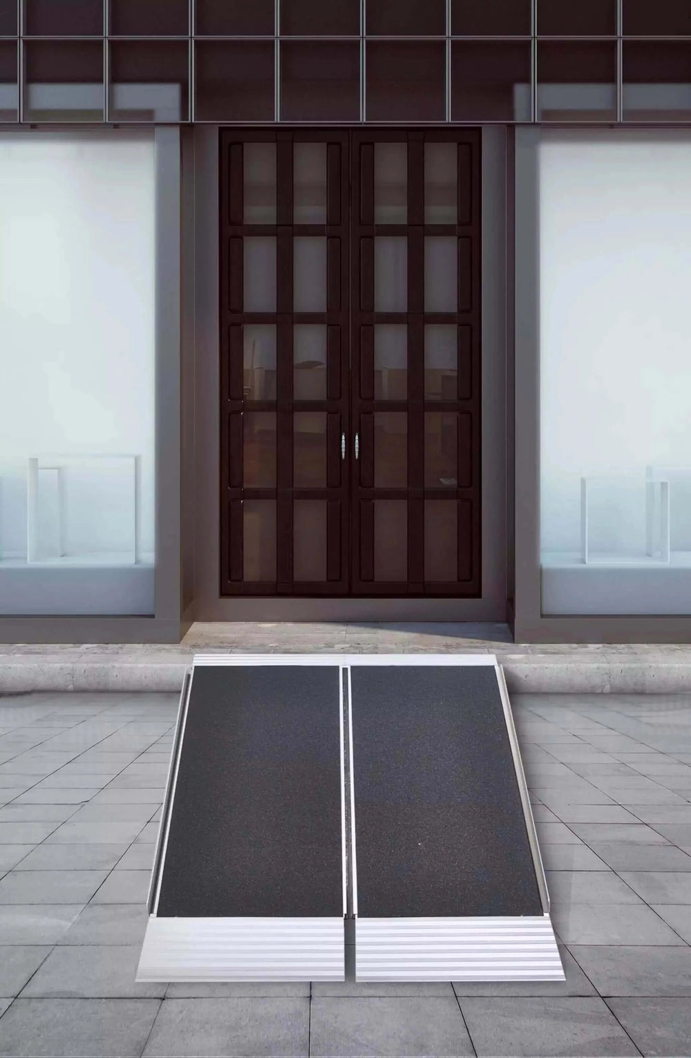National Ramp - Freedom Aluminum Folding Wheelchair Ramp sitting in front of a double door entrance