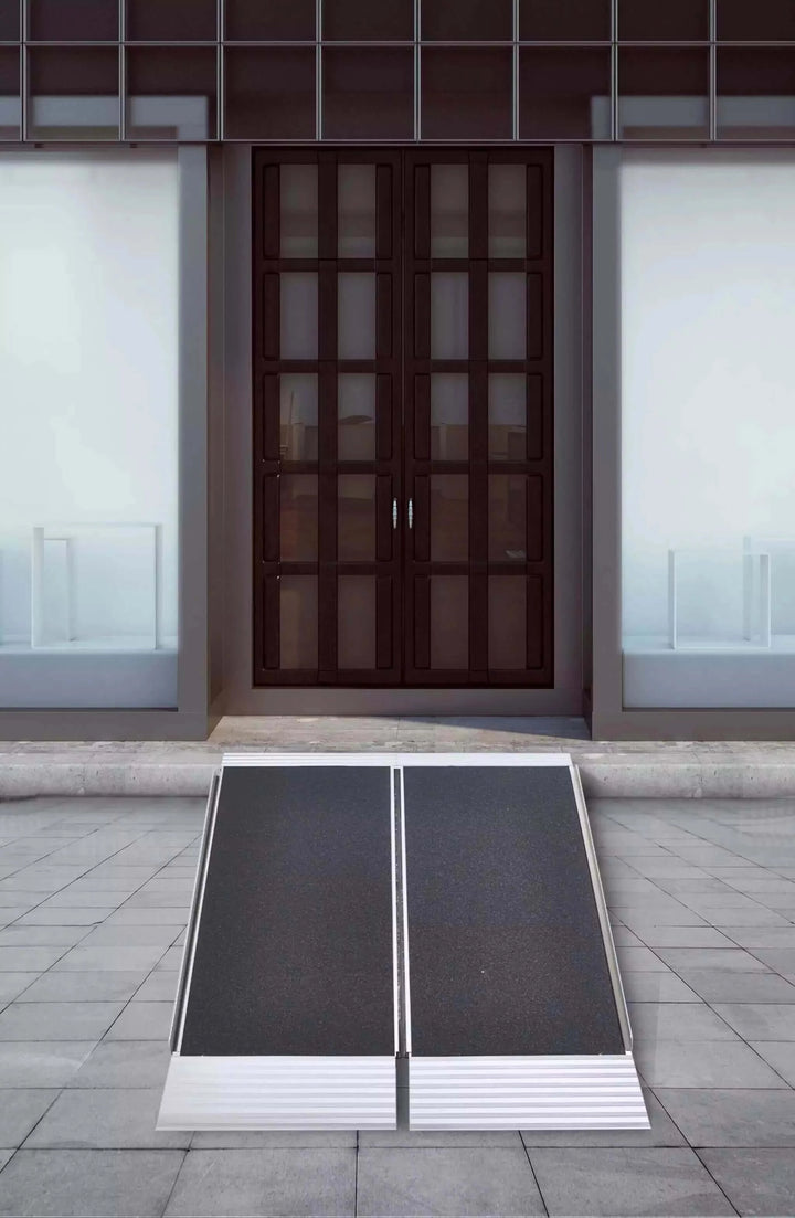National Ramp - Freedom Aluminum Folding Wheelchair Ramp sitting in front of a double door entrance
