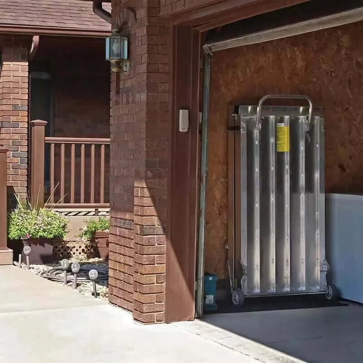 PVI - Wheel-A-Bout Aluminum Portable Wheelchair Ramp folded up in a user's garage