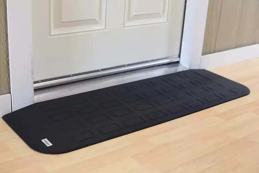 SafePath - EZ Edge Transition Rubber Threshold Ramp - 46" Width being used in front of a white door