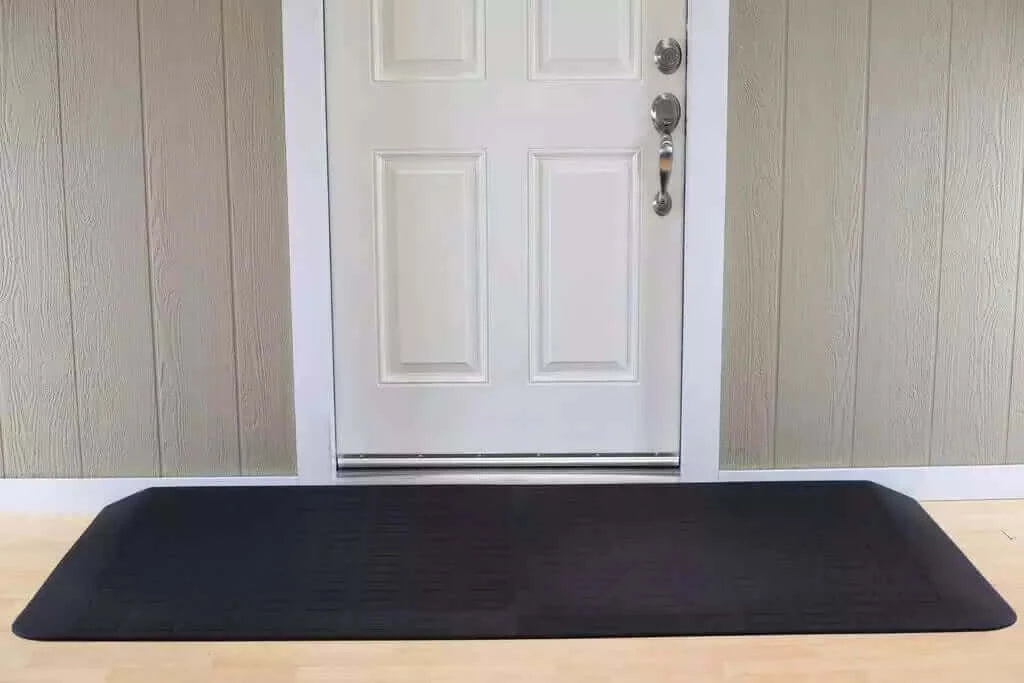 SafePath - EZ Edge Transition Rubber Threshold Ramp - 82" Width being used in front of a white door