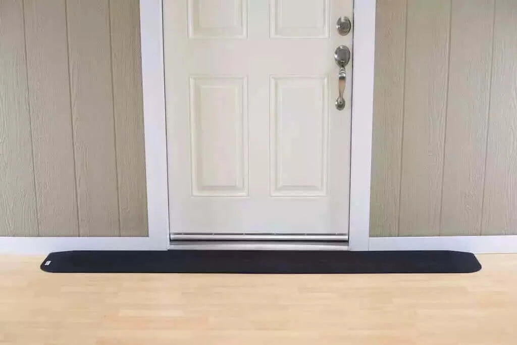 SafePath - EZ Edge Transition Rubber Threshold Ramp - 82" Width being used in front of a white door
