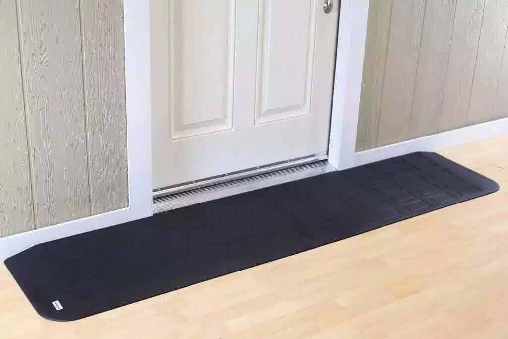 SafePath - EZ Edge Transition Rubber Threshold Ramp - 82" Width being used in front of a white door