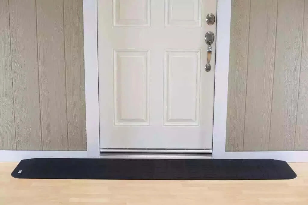 SafePath - EZ Edge Transition Rubber Threshold Ramp - 82" Width being used in front of a white door