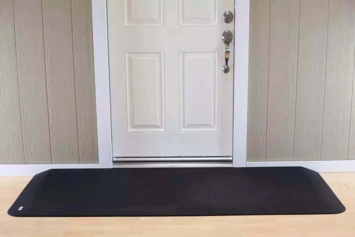 SafePath - EZ Edge Transition Rubber Threshold Ramp - 82" Width being used in front of a white door