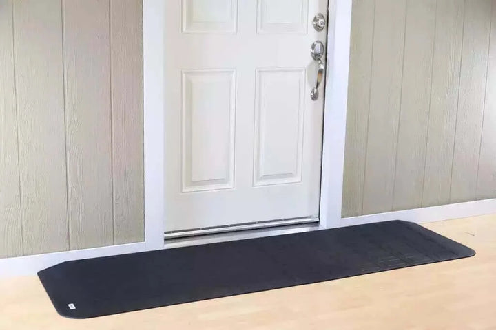 SafePath - EZ Edge Transition Rubber Threshold Ramp - 82" Width being used in front of a white door
