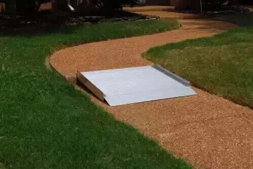 American Access - Sidekick Portable Solid Aluminum Wheelchair Ramp - ramp sitting on a walkway