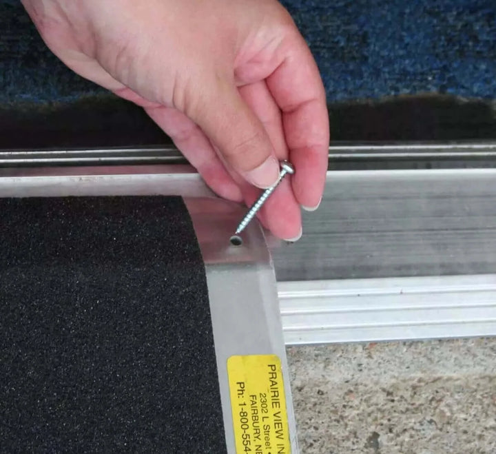 PVI - Aluminum Standard Solid Threshold Ramp for Wheelchairs zoomed in view showing the pin feature to secure the ramp down