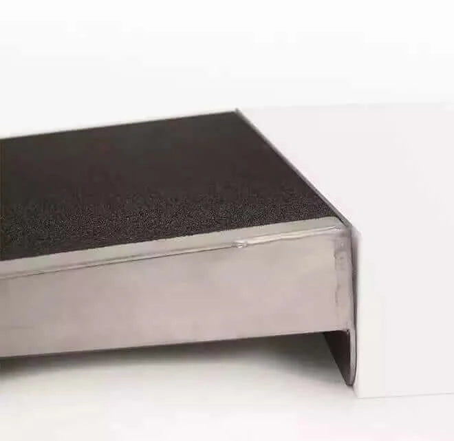 PVI - Aluminum Self Supporting Threshold Ramp for Wheelchairs zoomed in view of it butted up next to a threshold