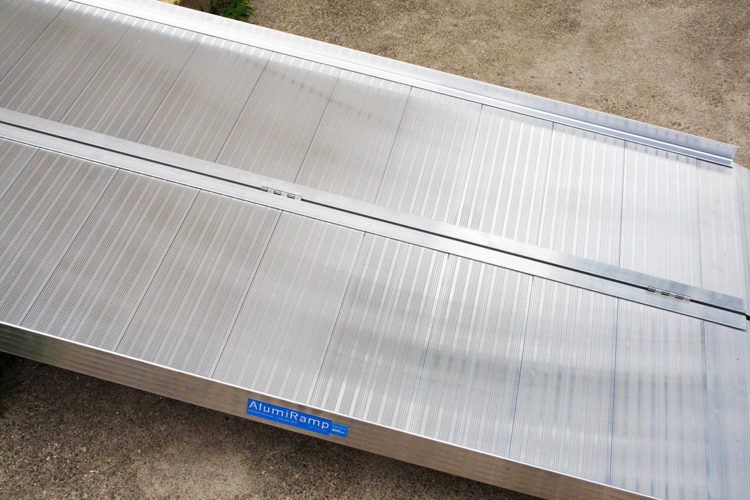 AlumiLite Folding Wheelchair Curb Ramp - zoomed in view of one unfolded