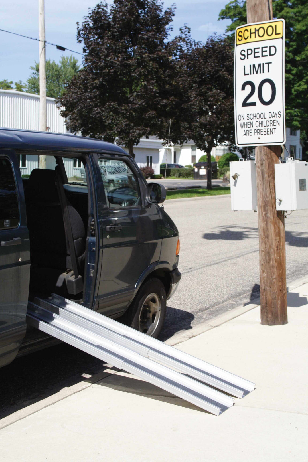 AlumiRamp - AlumiLite Telescopic Aluminum Wheelchair Van Channel Ramp - being used coming out of a vehicle