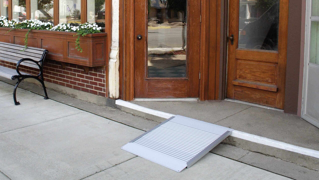AlumiRamp - Aluminum Threshold Ramp for Wheelchairs - zoomed out view of it being used in front of a one step entrance