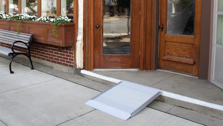 AlumiRamp - Aluminum Threshold Ramp for Wheelchairs - zoomed out view of it being used in front of a one step entrance