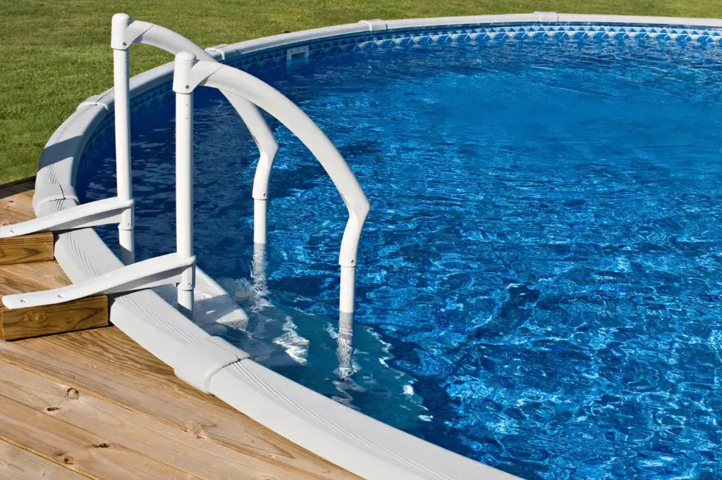 image of an above ground pool and the steps going out onto a deck