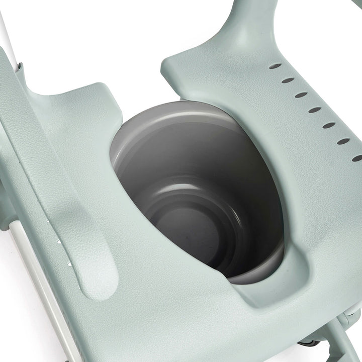 Close-up of a light blue cup holder with a black cup inside on a white background