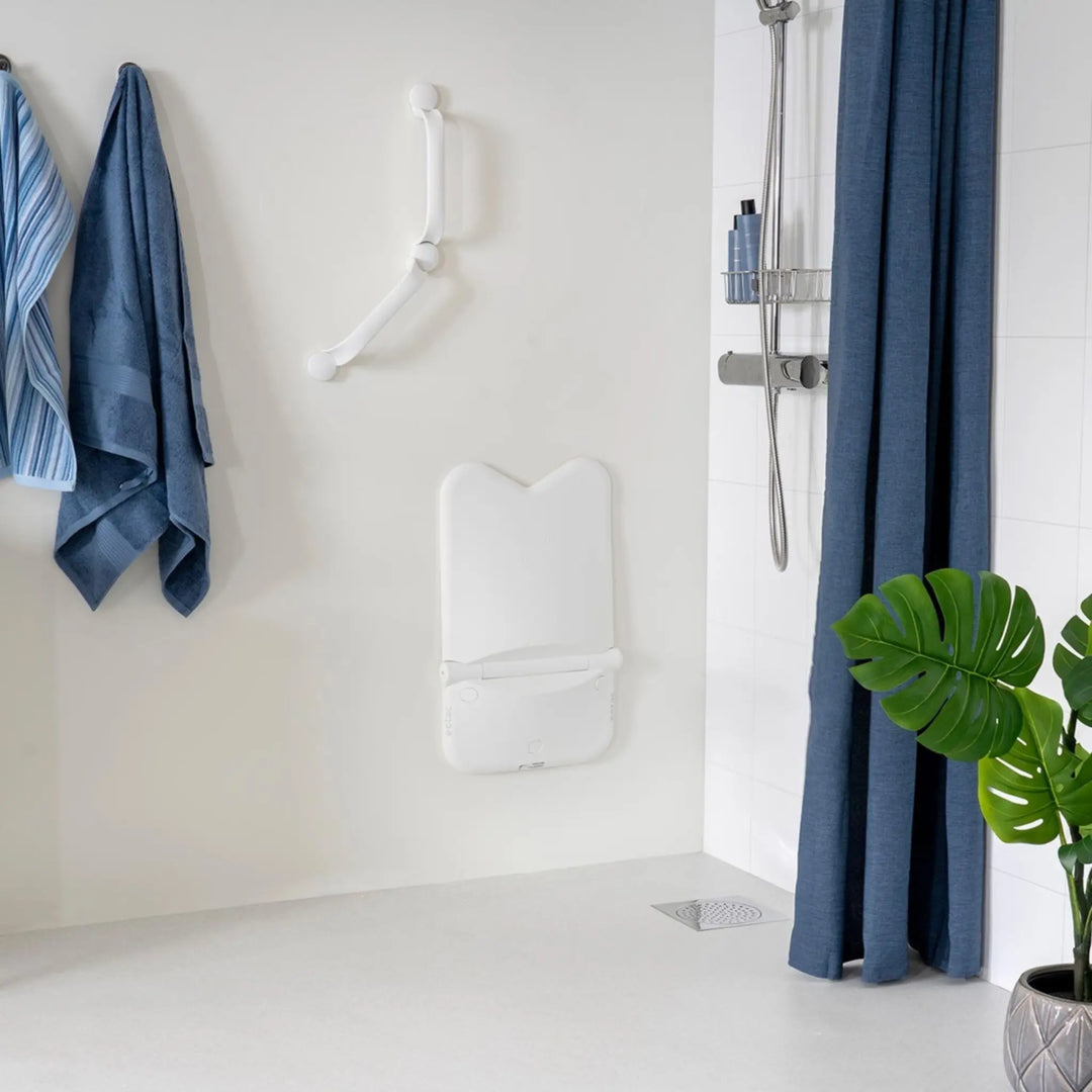 ETAC relax shower seat folded up against the wall white