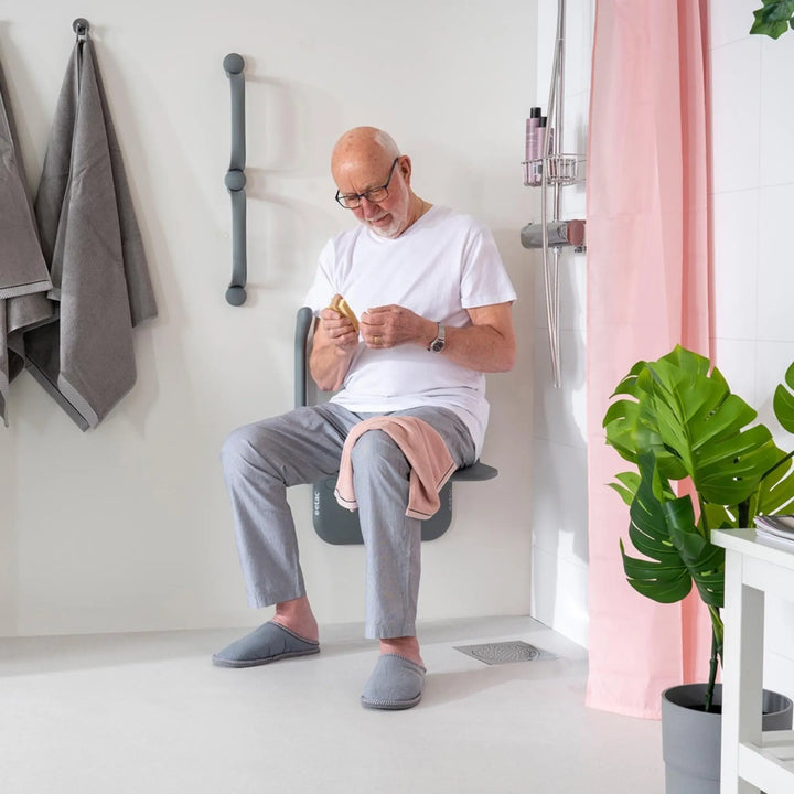 ETAC relax shower seat with man sitting on it